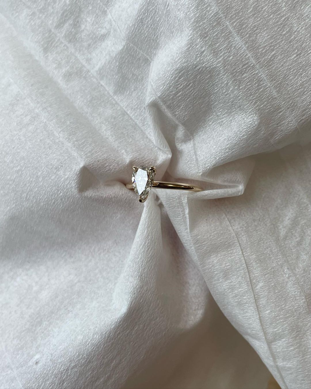 0.5ct Pear Three Claw Lab Grown Diamond Sophisticated -cut diamond ring set in a classic gold band, beautifully neutral-toned nails. A must-have for engagement proposals, high-end jewelry lovers, and wedding occasions. YouTube Amazon Facebook Weather Google Gmail Wordless WhatsApp Web Translate News blog post ring ceremony Article Life Money 2025 design Ring Ceremony Diamond Shape Diamond Ring Surat Diamond India Market Diamond Ring for Her Diamond Ring for Men Diamond Ring Women Engagement Ring Finger