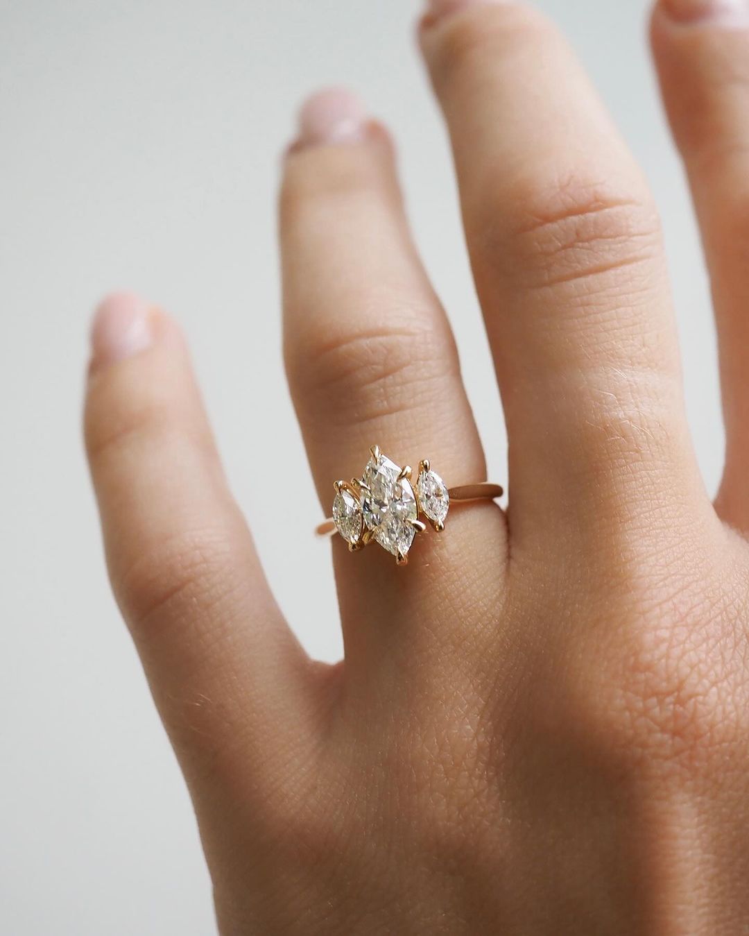 3tcw Marquise Cut Lab Grown Diamond Ring With Trio Set Close-up of a hand adorned with a sparkling diamond ring on a sleek gold band, featuring a modern and elegant design. The ring is perfect for engagement, wedding, or luxury jewelry collections. YouTube Amazon Facebook Weather Google Gmail Wordless WhatsApp Web Translate News blog post ring ceremony Article Life Money 2025 design Ring Ceremony Diamond Shape Diamond Ring Surat Diamond India Market Diamond Ring for Her Diamond Ring for Men Diamond Ring