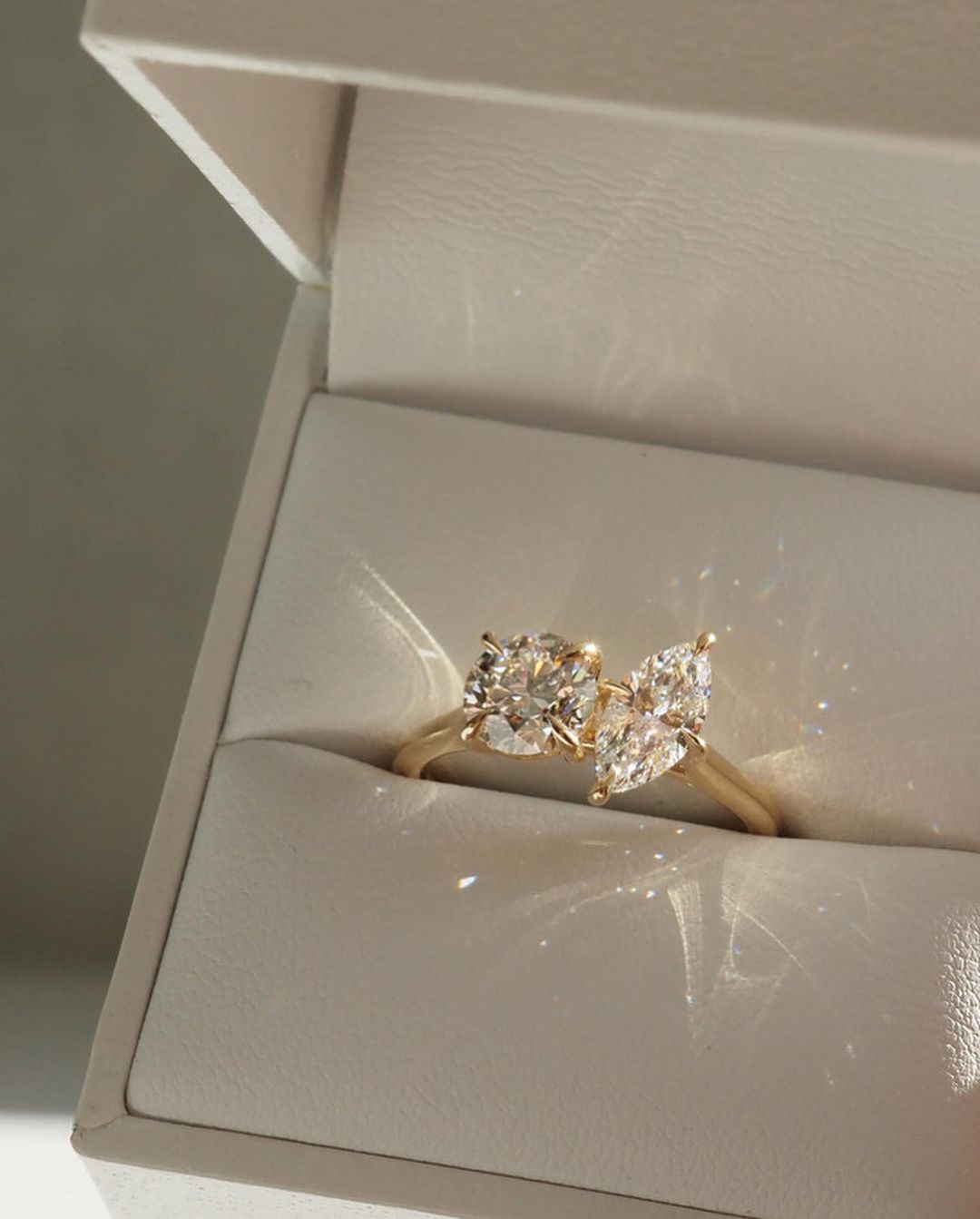 1ct Round And Marquise Toi Et Moi Cut Diamond Ring  The hand displays a soft, natural manicure, highlighting the diamond's brilliance and the ring's refined craftsmanship. Ideal for those seeking timeless, high-end accessories for special occasions. YouTube Amazon Facebook Weather Google Gmail Wordless WhatsApp Web Translate News blog post ring ceremony Article Life Money 2025 design Ring Ceremony Diamond Shape Diamond Ring Surat Diamond India Market Diamond Ring for Her Diamond Ring for Men Diamond Ring 