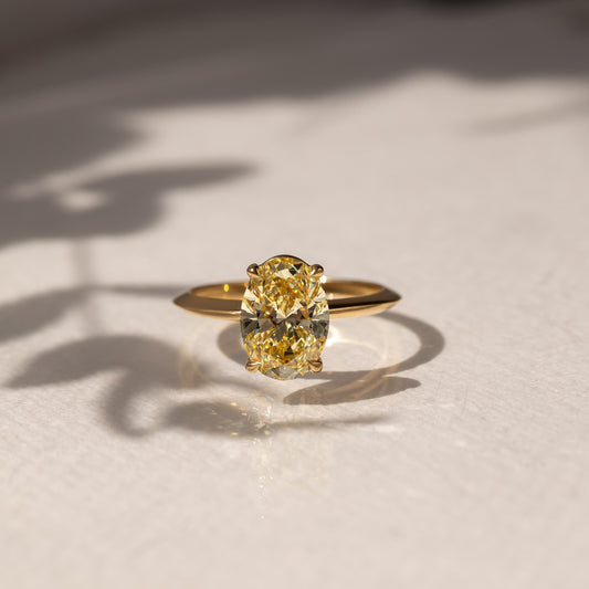 2.5ct Oval Cut Fancy Color Lab Grown Diamond Ring  The sleek gold band enhances its modern yet classic appeal, offering a perfect balance of luxury and refinement. diamond ring, gold engagement ring, luxury bridal jewelry, wedding accessories, YouTube Amazon Facebook Weather Google Gmail Wordless WhatsApp Web Translate News blog post ring ceremony Article Life Money 2025 design Ring Ceremony Diamond Shape Diamond Ring Surat Diamond India Market Diamond Ring for Her Diamond Ring for Men Diamond Ring Women 