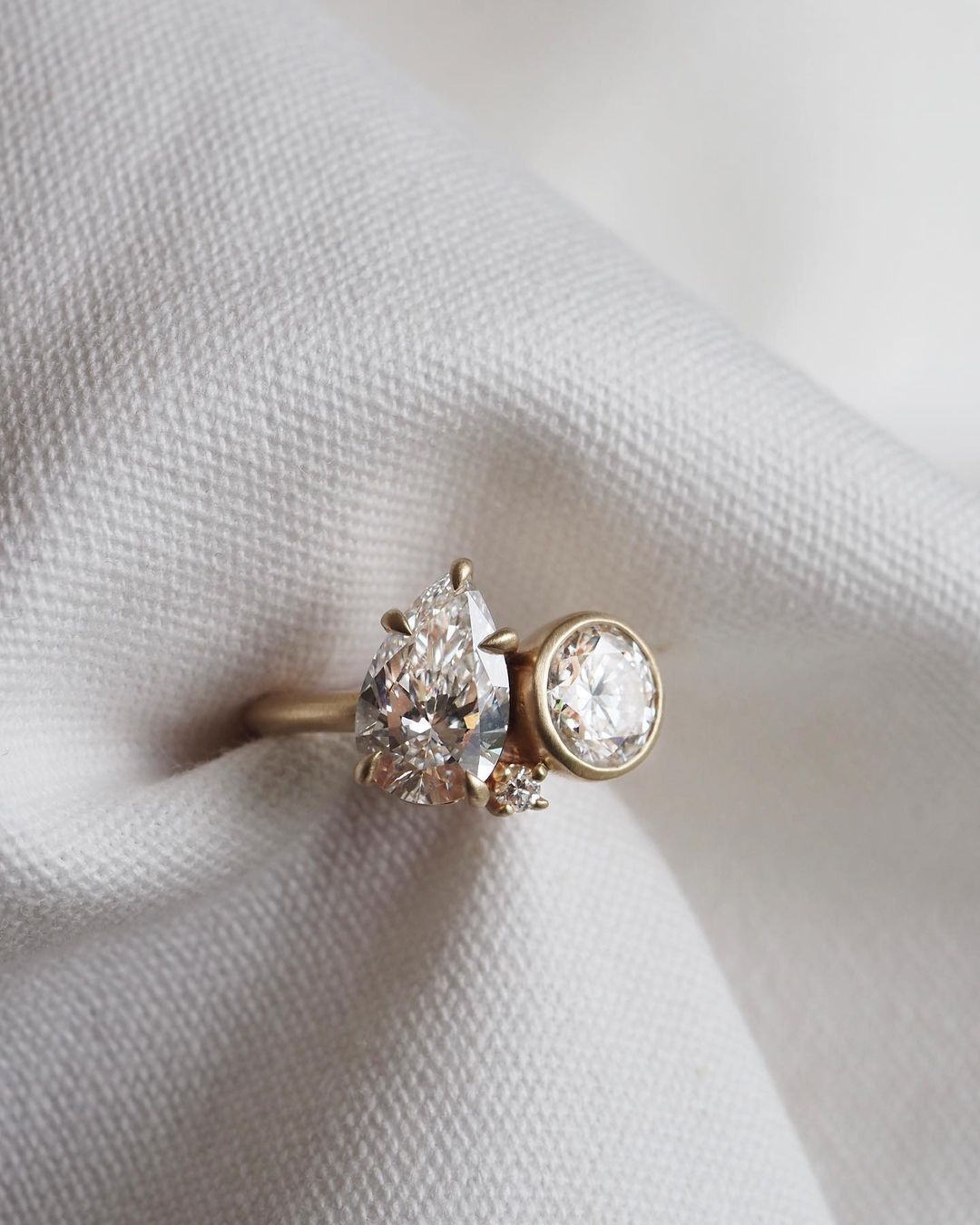 2ct Pear & Round Full Bezel Toi Et Moi Lab Grown Diamond Ring  Delicate gold band featuring princess-cut diamonds, designed for refined elegance. Statement gold ring with a radiant diamond centerpiece, ideal for a bold look. YouTube Amazon Facebook Weather Google Gmail Wordless WhatsApp Web Translate News blog post ring ceremony Article Life Money 2025 design Ring Ceremony Diamond Shape Diamond Ring Surat Diamond India Market Diamond Ring for Her Diamond Ring for Men Diamond Ring Women Engagement Ring 