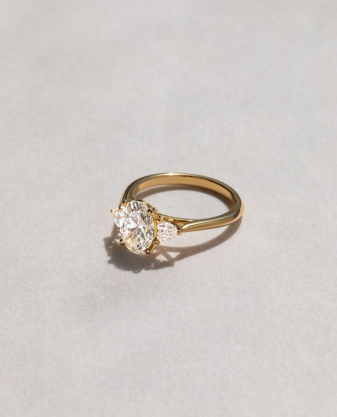 3.5ct Oval Cut Lab Grown Diamond Ring with Two Side Trillion Stone  This ring is more than just jewelry – it’s a statement piece that reflects premium craftsmanship and timeless beauty. diamond engagement ring, gold band, weddings, and luxury jewelry YouTube Amazon Facebook Weather Google Gmail Wordless WhatsApp Web Translate News blog post ring ceremony Article Life Money 2025 design Ring Ceremony Diamond Shape Diamond Ring Surat Diamond India Market Diamond Ring for Her Diamond Ring for Men Diamond Ring 
