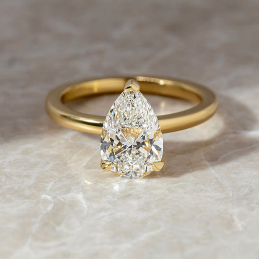 3.5ct Pear Cut Lab Grown Diamond With three Claw Designer gold ring set with high-quality diamonds, perfect for gifting.  Beautifully crafted diamond and gold ring, blending tradition with contemporary style. YouTube Amazon Facebook Weather Google Gmail Wordless WhatsApp Web Translate News blog post ring ceremony Article Life Money 2025 design Ring Ceremony Diamond Shape Diamond Ring Surat Diamond India Market Diamond Ring for Her Diamond Ring for Men Diamond Ring Women Engagement Ring Finger For Her Finger