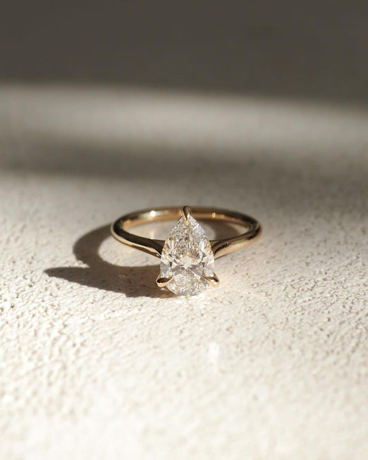 3.5ct Pear Solitaire three claw Lab Grown Diamond Ring Minimalist gold band with a single brilliant diamond, designed for understated elegance. Artisan-crafted gold ring with geometric diamond settings for a contemporary touch. YouTube Amazon Facebook Weather Google Gmail Wordless WhatsApp Web Translate News blog post ring ceremony Article Life Money 2025 design Ring Ceremony Diamond Shape Diamond Ring Surat Diamond India Market Diamond Ring for Her Diamond Ring for Men Diamond Ring Women Engagement Ring 