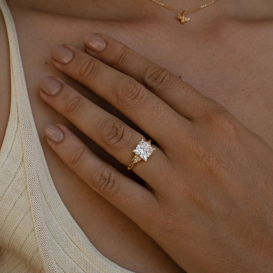 5ct Princess Cut Center & Both Side Round Cut Tiny Lab Grown Diamond Ring Classic  diamond solitaire on a sleek gold band, highlighted on a manicured hand, perfect for wedding and engagement themes. diamond ring, gold engagement ring, luxury bridal jewelry, wedding accessories YouTube Amazon Facebook Weather Google Gmail Wordless WhatsApp Web Translate News blog post ring ceremony Article Life Money 2025 design Ring Ceremony Diamond Shape Diamond Ring Surat Diamond India Market Diamond Ring for Her Diamond 