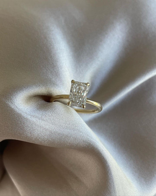 7ct Radiant Cut Four Claw Lab Grown Diamond Solitaire Ring Radiant gold-banded diamond engagement ring with a, displayed on a hand with a chic manicure for bridal and luxury jewelry lovers. modern engagement rings, premium wedding bands, or high-end diamond rings. YouTube Amazon Facebook Weather Google Gmail Wordless WhatsApp Web Translate News blog post ring ceremony Article Life Money 2025 design Ring Ceremony Diamond Shape Diamond Ring Surat Diamond India Market Diamond Ring for Her Diamond Ring for Men 