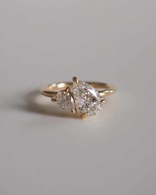 3tcw Duet Pear Cut Toi Et Moi Lab Grown Diamond Ring Delicate gold band featuring princess-cut diamonds, designed for refined elegance. Statement gold ring with a radiant diamond centerpiece, ideal for a bold look. YouTube Amazon Facebook Weather Google Gmail Wordless WhatsApp Web Translate News blog post ring ceremony Article Life Money 2025 design Ring Ceremony Diamond Shape Diamond Ring Surat Diamond India Market Diamond Ring for Her Diamond Ring for Men Diamond Ring Women Engagement Ring Finger For Her 