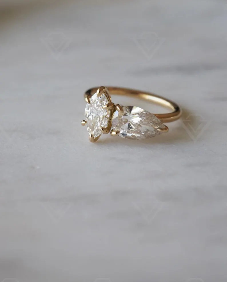 2.10tcw marquise and pear-shaped lab-grown diamond ring with a unique Toi et Moi setting, ideal for a meaningful and sustainable wedding or promise ring.
