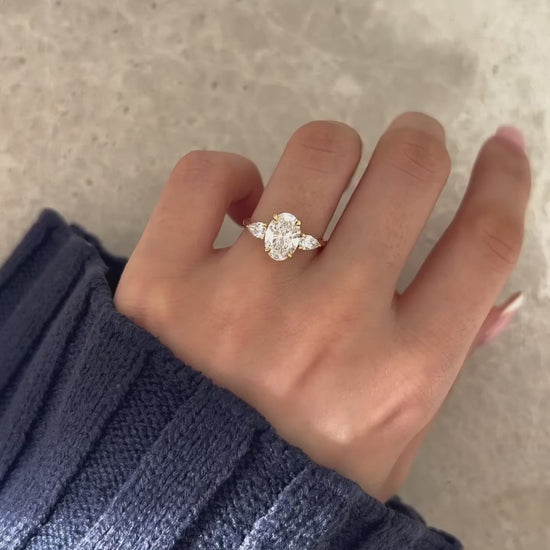 2.5ct Oval Cut Center Stone With Two side Pear Cut This diamond ring Whether you're planning a proposal, celebrating an anniversary, or looking for the ideal wedding band, this exquisite piece of jewelry will stand out.  YouTube Amazon Facebook Weather Google Gmail Wordless WhatsApp Web Translate News blog post ring ceremony Article Life Money 2025 design Ring Ceremony Diamond Shape Diamond Ring Surat Diamond India Market Diamond Ring for Her Diamond Ring for Men Diamond Ring Women Engagement Ring Finger 