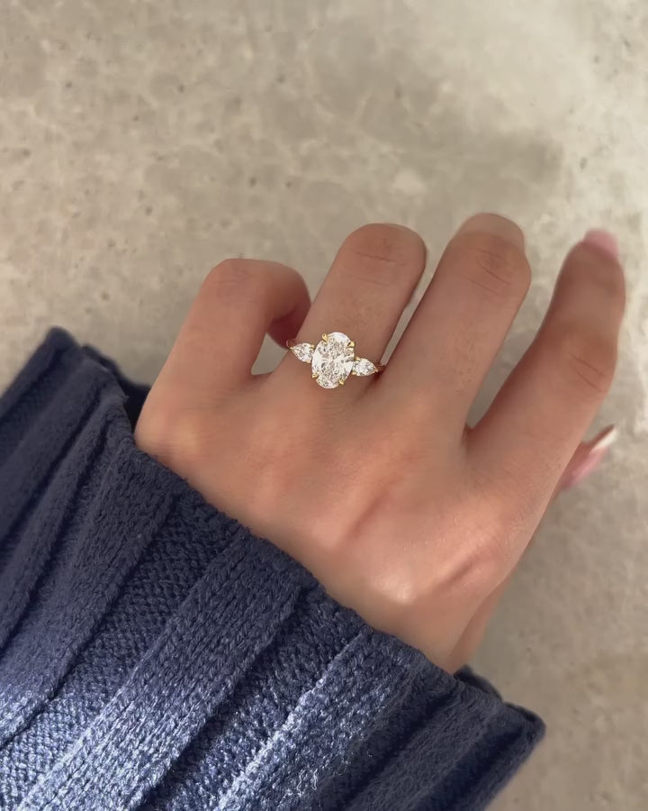 2.5ct Oval Cut Center Stone With Two side Pear Cut This diamond ring Whether you're planning a proposal, celebrating an anniversary, or looking for the ideal wedding band, this exquisite piece of jewelry will stand out.  YouTube Amazon Facebook Weather Google Gmail Wordless WhatsApp Web Translate News blog post ring ceremony Article Life Money 2025 design Ring Ceremony Diamond Shape Diamond Ring Surat Diamond India Market Diamond Ring for Her Diamond Ring for Men Diamond Ring Women Engagement Ring Finger 