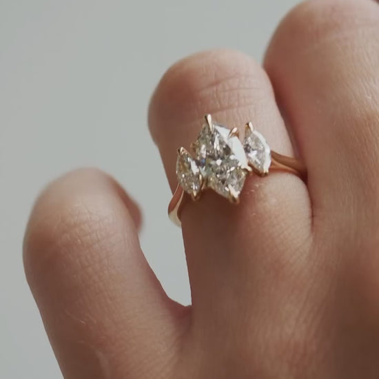 3tcw Marquise Cut Lab Grown Diamond Ring With Trio Set  The hand displays a soft, natural manicure, highlighting the diamond's brilliance and the ring's refined craftsmanship. Ideal for those seeking timeless, high-end accessories for special occasions. YouTube Amazon Facebook Weather Google Gmail Wordless WhatsApp Web Translate News blog post ring ceremony Article Life Money 2025 design Ring Ceremony Diamond Shape Diamond Ring Surat Diamond India Market Diamond Ring for Her Diamond Ring for Men Diamond 